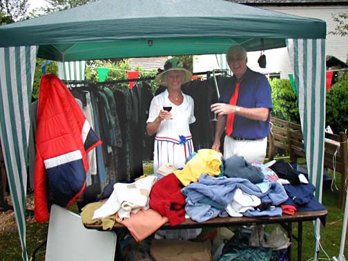 Shelagh and Graham Nunn enjoy a glass of wine at their clothes stall