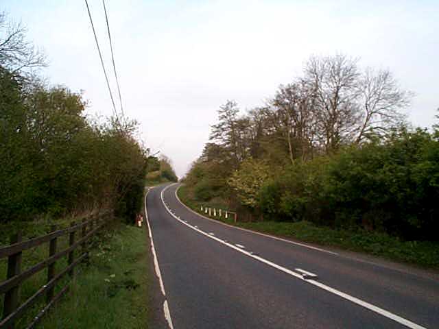 E along A4013, boundary crosses road, follows the Leadon